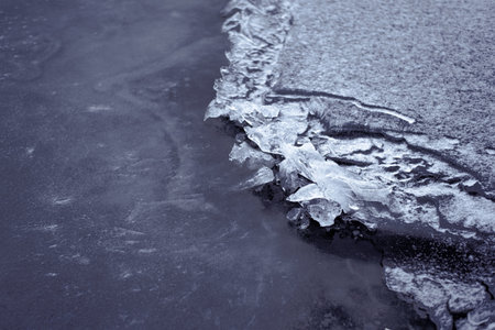 Broken Ice on Frozen Lake or River in Cold Weather.