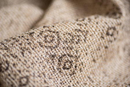 Close Up of Natural Woven Textile with Rustic Texture Beige and Brown Fabric Pattern.