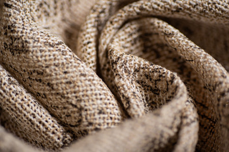 Close Up of Natural Woven Textile with Rustic Texture Beige and Brown Fabric Pattern.
