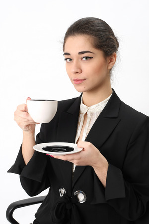 business woman with a cup of coffee on white backgroundの写真素材