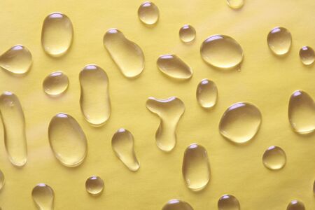 large drops of water on a yellow background