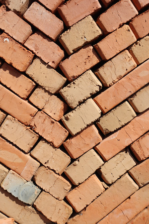 clay bricks stacked herringbone. close-upの写真素材
