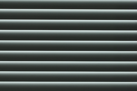 abstract background and texture. closed gray shutters metal close-upの写真素材