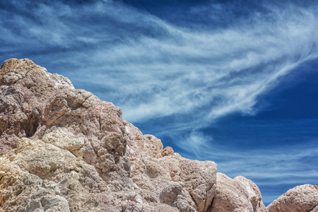 Cyclades blue sky and volcanic rockの写真素材