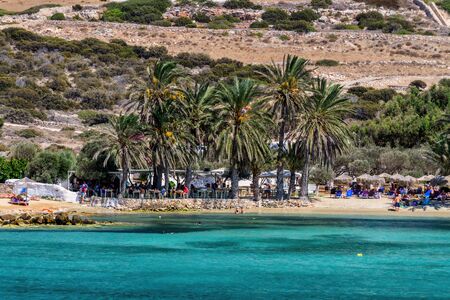 Agia Irini beach, Paros island, Greece. Beautiful greek beach with palms in Cyclades Islands