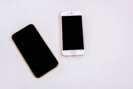 8.20.2019 - Kyiv, Ukraine: Pink iphone 6S and yellow iphone XRのeditorial素材