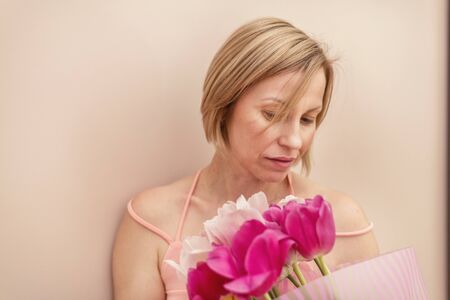 Woman with a bouquet of tulips at spring time