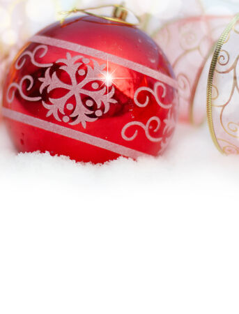 Christmas background with Christmas toys in the snowの写真素材