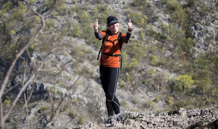 Woman hiker standing and gesturing OK sign. National park Paklenica, the part of Velebit; the largest mountain range in Croatia.のeditorial素材