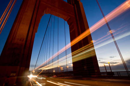 Long exposure of cars passing through one of the towers of the Golden Gate Bridge. Shot in San Francisco.の写真素材