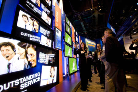 LAS VEGAS - JANUARY 8, 2009: People are looking at an impressive wall of TVs at the 2009 Consumer...