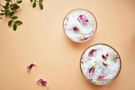 Set of cosmetics for women's skin and body care, sea salt on a gray marble background. Beauty...