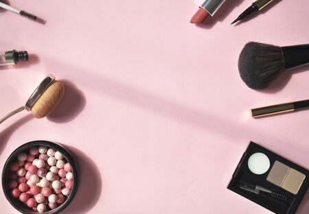 A set of decorative cosmetics on a pink background. Top viev. Flat lay.の写真素材