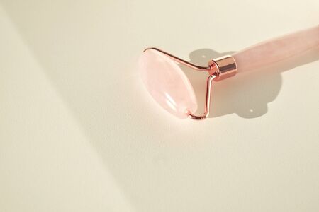 Quartz roller for face massage. Pink gouache facial massager tools. Anti-aging, lifting and toning...
