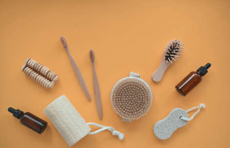Zero waste. Bathroom accessories, natural brush, wooden comb, oil, makeup remover in a glass container, bamboo toothbrushes. Eco product concept.の写真素材