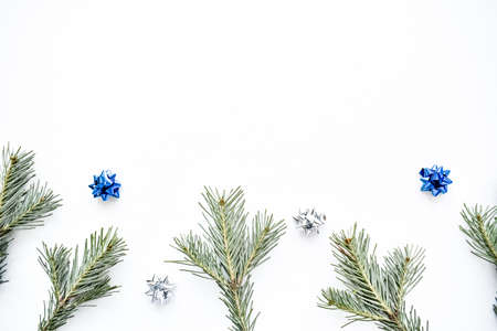 Christmas background. Branches of a Christmas tree on a white background. Top view.