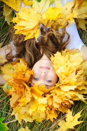 young woman on the autumn fieldの写真素材