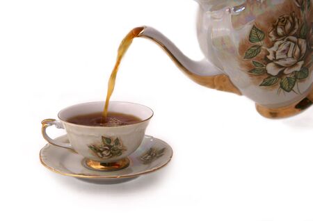 teacup with teapot isolated on whiteの写真素材