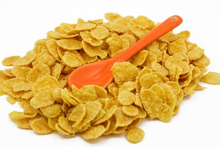 good dry cereal with orange spoonの写真素材
