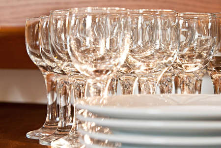 glass and plate on brown tableclothの写真素材