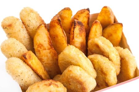 Box with roast chicken nuggets, stick and potatoの写真素材