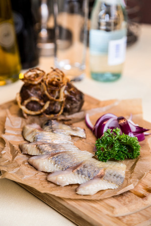 Restourant serving dish - pieces herring for snackの写真素材
