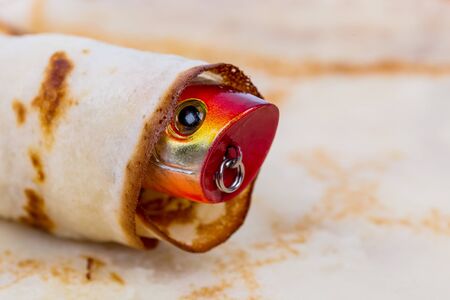front a fishing tackle lure rolled in pancake