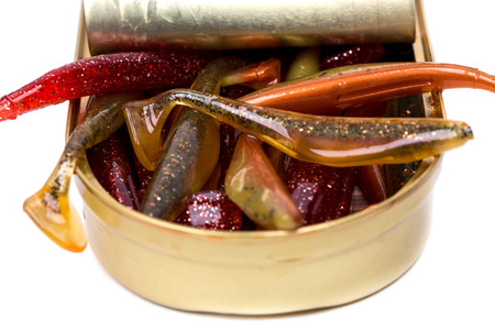 fishing tackles Swimbait different colors in open can on white backgroundの写真素材
