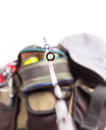 selective focus the guide ring on rod with background from fishing tackles in handbagの写真素材