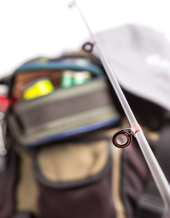 selective focus the guide ring on rod with background from fishing tackles in handbagの写真素材