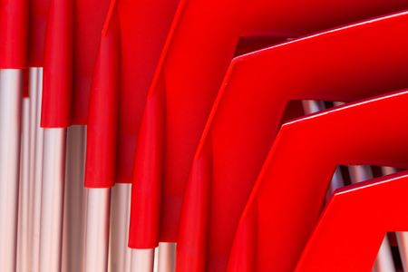 details of stack red chairs from hard plastic. abstract form for design or backgroundの写真素材