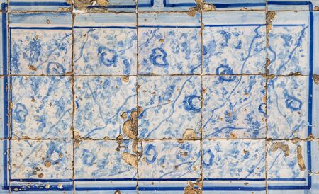 traditional azulejos tiles on facade of old house in Portugal