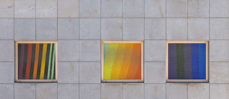 reflection colored tiles in window on wall