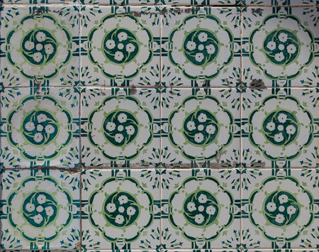 traditional azulejos tiles on facade of old house in Portugal