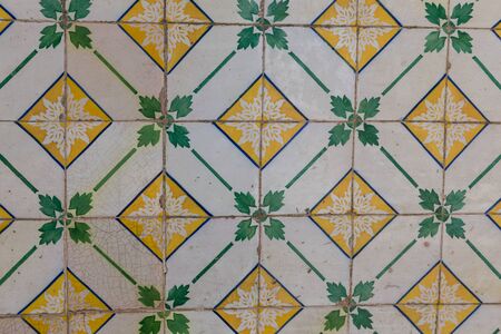 traditional azulejos tiles on facade of old house in Portugal