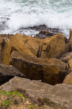 landscape atlantic coastline in europe, with surfes in cloudy day