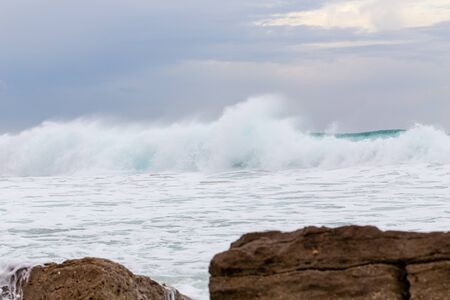 Ocean coast, moviment waves with foam. Wind power. Turquoise water. 