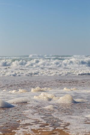 Ocean coast, moviment waves with foam. Wind power. Turquoise water.の写真素材