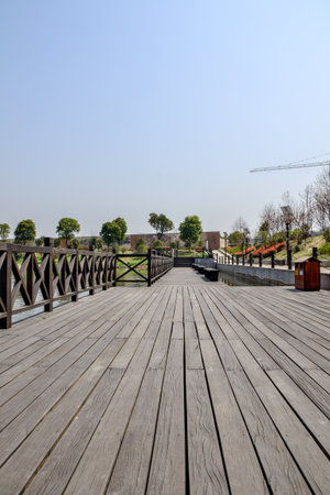 Wooden walkway in the park, closeup of photo.の写真素材