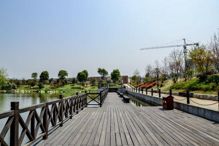 Wooden bridge over the river in a park, Luannan County, Hebei Province, China.の写真素材