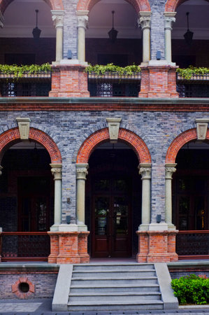 Brick building with arched windows and archs, in Singaporeの写真素材
