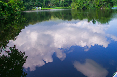 Reflection of clouds in the lake with blue sky and white cloudsの写真素材
