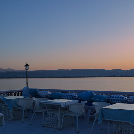 Cafe on the bank of the lake at sunset, Crete, Greeceの写真素材