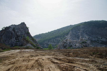 Landscape of mountain road with rocks and trees in the background.の写真素材
