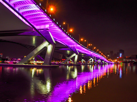 Night view of the bridge over the river in Hangzhou, Chinaの写真素材