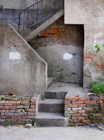 Staircase in the old house with concrete walls and concrete stairs