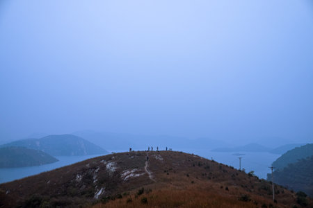 Unidentified people on the top of the mountain.の写真素材