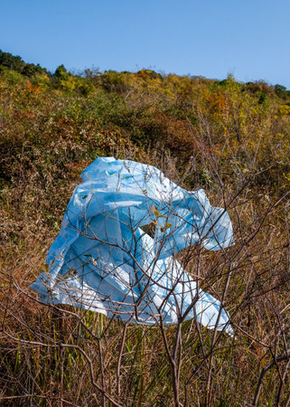 Plastic bag on the hill in autumn, closeup of photoの写真素材