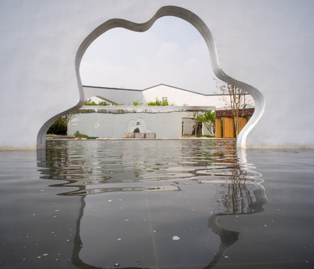 Reflection in the water of a modern house in the form of a heartの写真素材