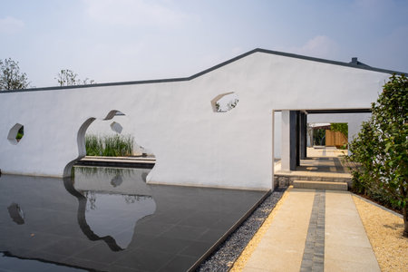 White wall of the house with reflection in the water, closeup of photoの写真素材